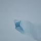 Iceberg in snowstorm with heavy wind and snowflakes.